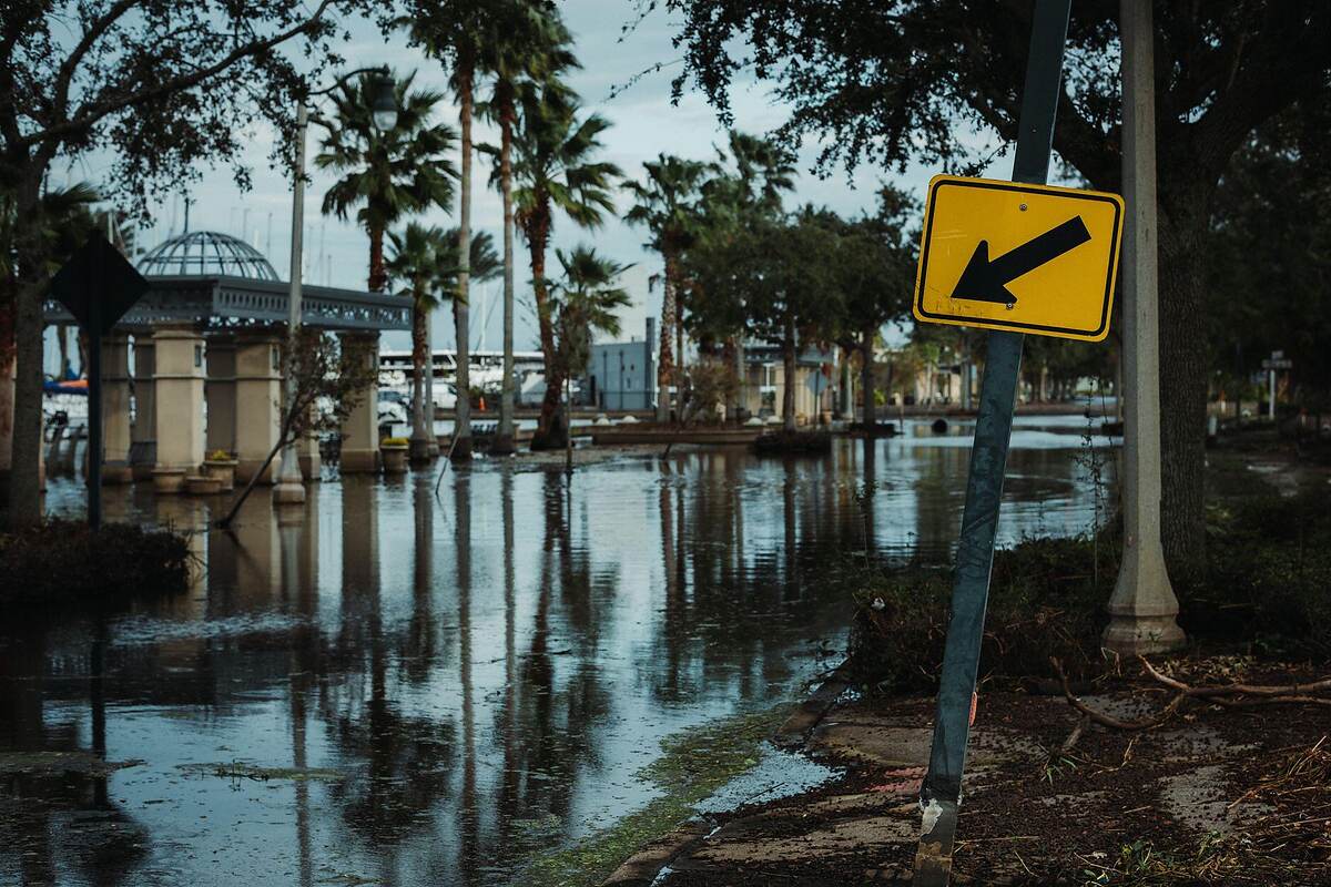 Floodwater covering a residential street after a storm