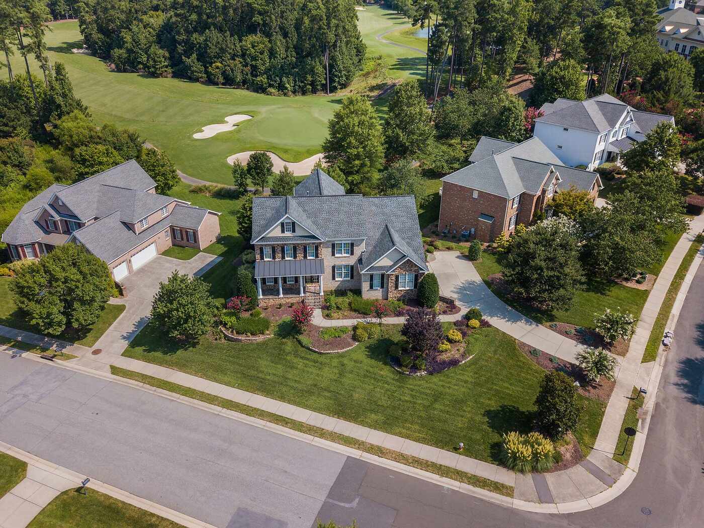 Two-story subdivision houses backing onto a retention pond